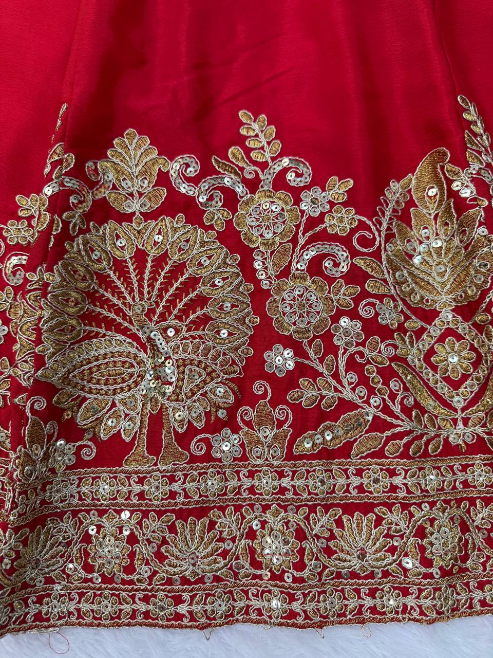 Regal Crimson Red Bridal Lehenga Choli Ensemble Featuring Intricate Gold Zari Embroidery, Heritage Motifs, and Embellished Tassels